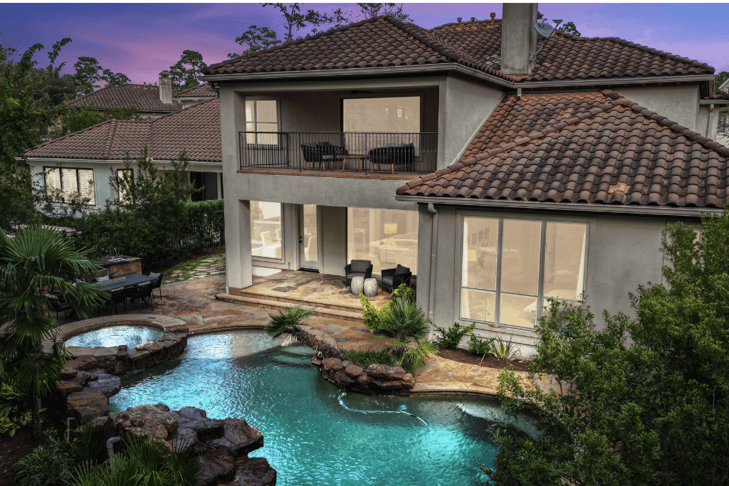 HDR twilight photograph balancing exterior details, illuminated windows, and dusk sky color.