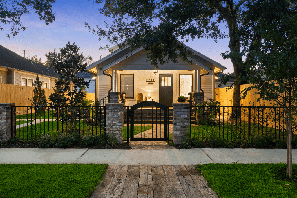 Enhanced twilight real estate image emphasizing evening curb appeal and architectural lighting.