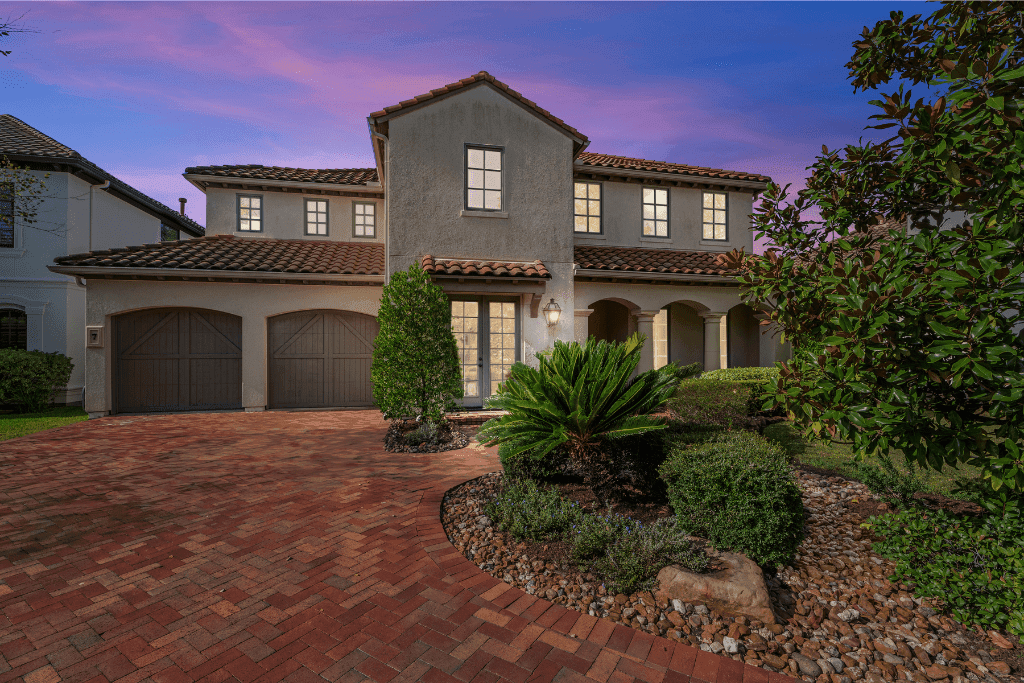 Virtual twilight HDR enhancement with balanced sky, landscaping, and warm property lighting.