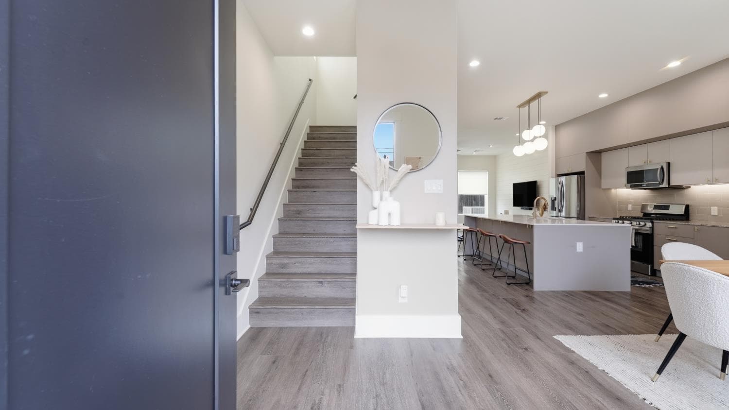 Entry view showing the stairs, kitchen, and open living space at 4606 Fisk St B.