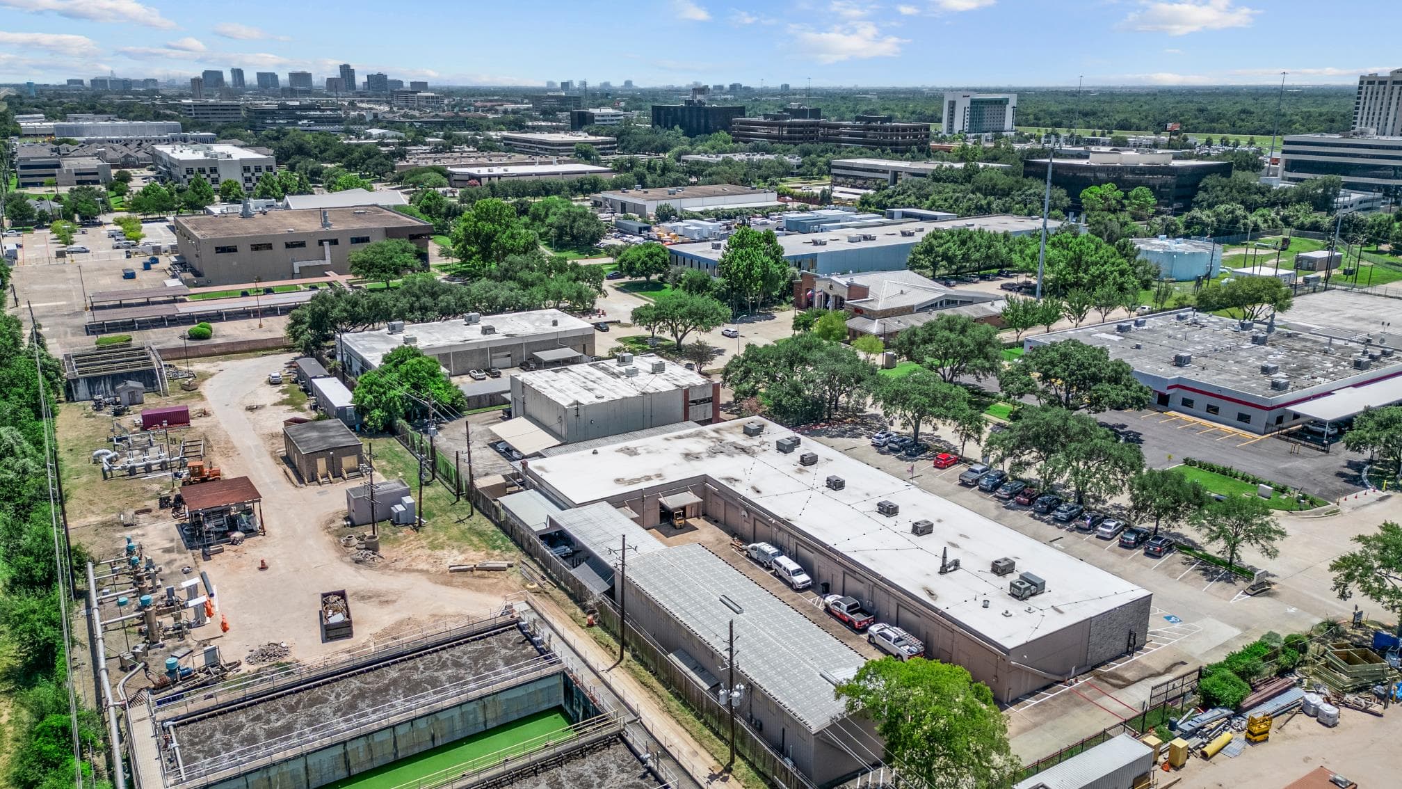 High aerial view of the Park Row commercial district surrounding the property.