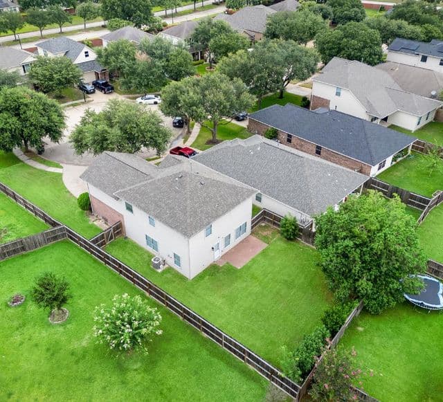 Aerial real estate photo showing the home and surrounding Cypress neighborhood.