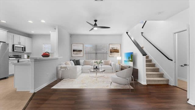 Open living room and kitchen area inside 20527 Rustic Rail Ct.