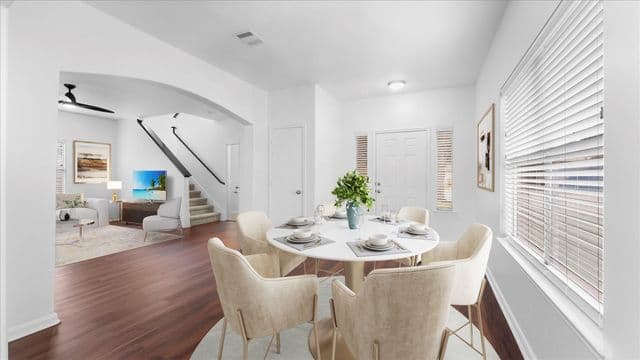 Dining area and entry flow photographed for the Cypress listing.